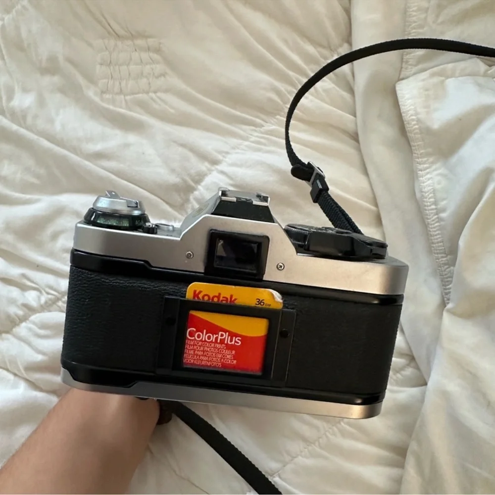 Canon AE-1 35mm Film Camera in Silver and Black with Lens